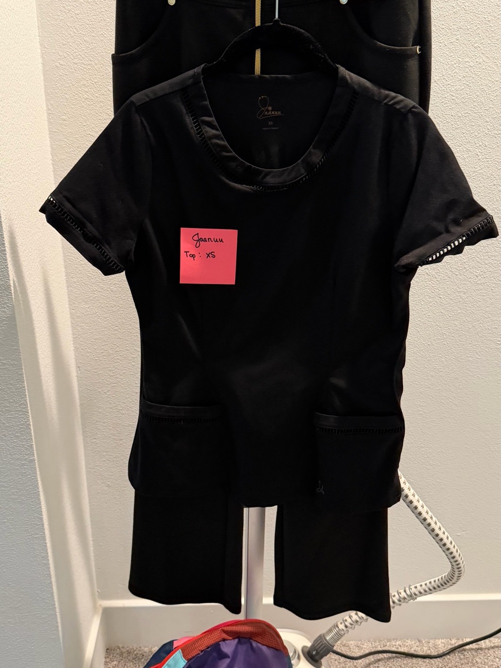 Jaanuu Black Short-Sleeve Kids Tee with Front Pockets
